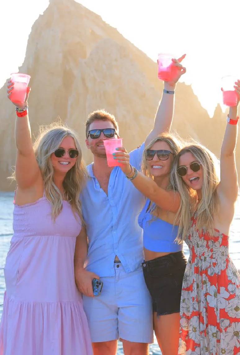 Guests enjoying sunset cocktails on private cruise Cabo San Lucas