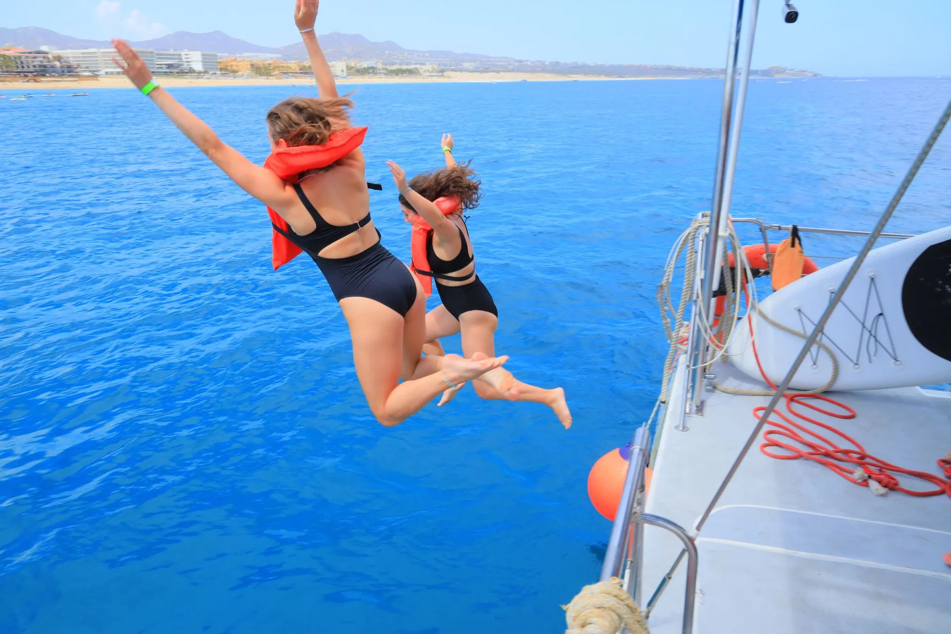 jumping-off-catamaran-los-cabos