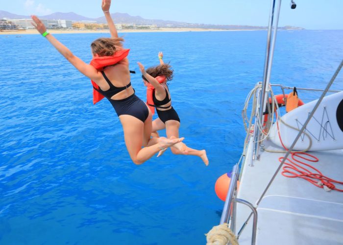 jumping-off-catamaran-los-cabos